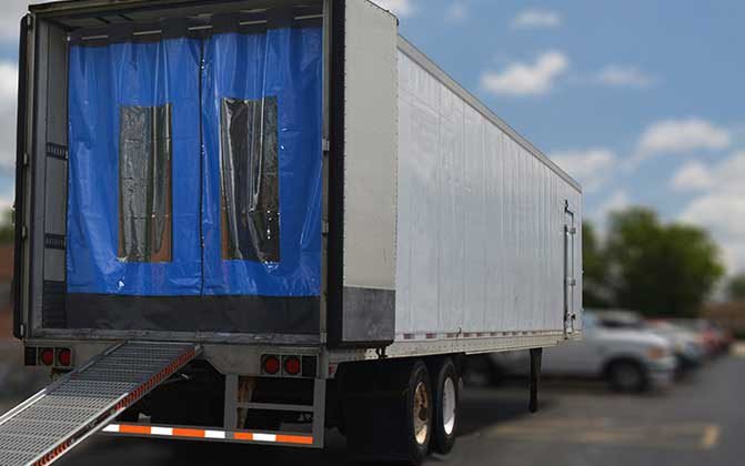 Trailer curtains help form a barrier between the cool air within the trailer and the warm, humid outside air